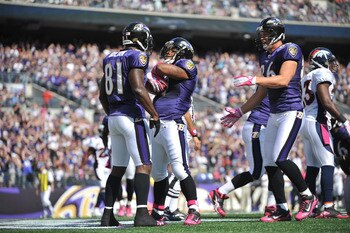 BALTIMORE, MD - OCTOBER 10: Ray Rice #27 of the Baltimore Ravens celebrates a touchdown against the Denver Broncos at M&T Bank Stadium on October 10, 2010 in Baltimore, Maryland. Players wore pink in recognition of Breast Cancer Awareness Month. The Raven