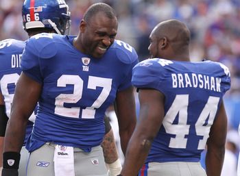 EAST RUTHERFORD, NJ - OCTOBER 17:  Brandon Jacobs #27 of the New York Giants talks with Ahmad Bradshaw #44 against the Detroit Lions at New Meadowlands Stadium on October 17, 2010 in East Rutherford, New Jersey.  (Photo by Nick Laham/Getty Images)