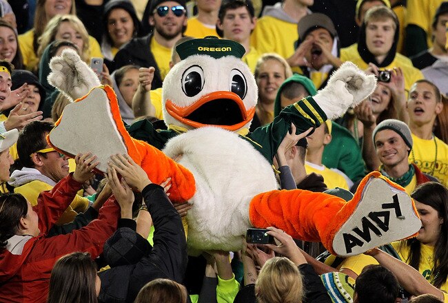 EUGENE, OR - OCTOBER 21:  The Oregon Duck mascot is lifted into the crowd during the game against the UCLA Bruins  on October 21, 2010 at the Autzen Stadium in Eugene, Oregon.  (Photo by Jonathan Ferrey/Getty Images)