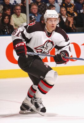 TORONTO - DECEMBER 29:  Maxim Afinogenov #61 of the Buffalo Sabres skates with the puck against the Toronto Maple Leafs during the NHL game at Air Canada Centre December 29, 2005 in Toronto, Ontario, Canada. (Photo by Graig Abel/Getty Images)