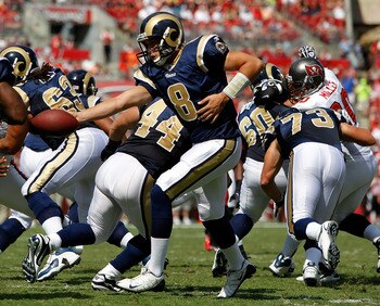 TAMPA, FL - OCTOBER 24:  Quarterback Sam Bradford #8 of the St. Louis Rams hands the ball off against the Tampa Bay Buccaneers during the game at Raymond James Stadium on October 24, 2010 in Tampa, Florida.  (Photo by J. Meric/Getty Images)