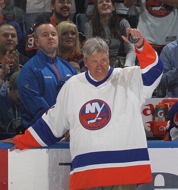 UNIONDALE, NY - OCTOBER 09:  New York Jets coach Rex Ryan gets ready to drop the ceremonial puck between Brenden Morrow #10 of the Dallas Stars and Doug Weight #93 of the New York Islanders prior to the Islanders home opener at the Nassau Coliseum on Octo