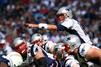 SAN DIEGO - OCTOBER 24:  Quarterback Tom Brady #12 of the New England points at the defense at the line of scrimmage against the San Diego Chargers during their NFL game on October 24, 2010 at Qualcomm Stadium in San Diego, California. (Photo by Donald Mi