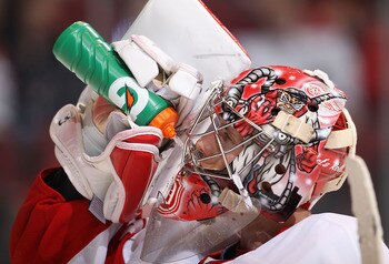 GLENDALE, AZ - OCTOBER 16:  Goaltender Jimmy Howard #35 of the Detroit Red Wings drinks water during a break from the NHL game against the Phoenix Coyotes at Jobing.com Arena on October16, 2010 in Glendale, Arizona.  The Red Wings defeated the Coyotes 2-1