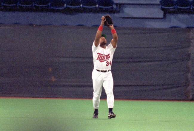 MINNEAPOLIS - OCTOBER 20:  Kirby Puckett #34 of the Minnesota Twins reaches for a pop fly during Game two of the 1991 World Series against the Atlanta Braves at the Metrodome on October 20, 1991 in Minneapolis, Minnesota. The Twins defeated the Braves 3-2