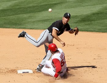 ANAHEIM, CA - SEPTEMBER 26:  Second baseman Omar Vizquel #11 of the Chicago White Sox throws to first to complete a double play after forcing out Bobby Abreu #53 of the Los Angeles Angels of Anaheim to end the fifth inning on September 26, 2010 at Angel S