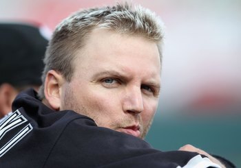 PHOENIX - MARCH 10:  A.J. Pierzynski #12 of the Chicago White Sox sits in the dugout during the MLB spring training game against the Oakland Athletics at Phoenix Municipal Stadium on March 10, 2010 in Phoenix, Arizona. The White Sox defeated the A's 9-5