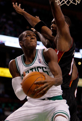 BOSTON, MA - OCTOBER 26: Rajon Rondo #9 of the Boston Celtics beats Chris Bosh #1 of the Miami Heatto the basket at the TD Banknorth Garden on October 26, 2010 in Boston, Massachusetts. NOTE TO USER: User expressly acknowledges and agrees that, by downloa