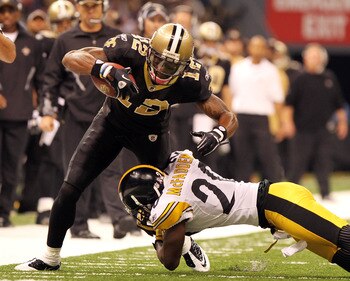 NEW ORLEANS - OCTOBER 31: Marques Colston #12 of the New Orleans Saints is tackled by Bryant McFadden #20 of the Pittsburgh Steelers at the Louisiana Superdome on October 31, 2010 in New Orleans, Louisiana. (Photo by Matthew Sharpe/Getty Images)