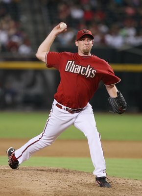 PHOENIX - AUGUST 05:  Brandon Webb #17 of the Arizona Diamondbacks pitches during the game against the Pittsburgh Pirates at Chase Field on August 5, 2008 in Phoenix, Arizona.  (Photo by Lisa Blumenfeld/Getty Images)