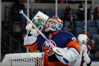 UNIONDALE, NY - OCTOBER 16:  Dwayne Roloson #30 of the New York Islanders skates against the Colorado Avalanche on October 16, 2010 at Nassau Coliseum in Uniondale, New York.  (Photo by Jim McIsaac/Getty Images)