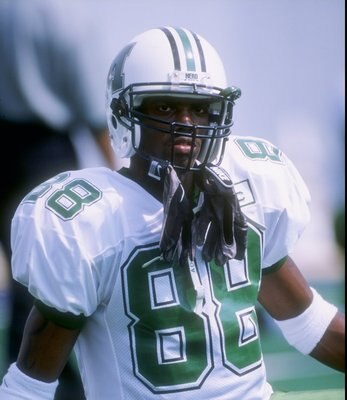 30 Aug 1997:  Wide receiver Randy Moss of the Marshall Thundering Herd stands on the field during a game against the West Virginia Mountaineers at Mountaineer Field in Morgantown, West Virginia.  West Virginia won the game 42-31. Mandatory Credit: Rick St