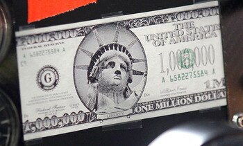 CONCORD, NC - MAY 21:  A general view of a fake million dollar bill that was taped to the dash of the #00 Aaron's Dream Machine Toyota, driven by David Reutimann (not pictured), during practice for the NASCAR Sprint Cup Series All-Star Race at Charlotte M