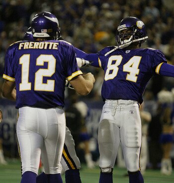 MINNEAPOLIS - SEPTEMBER 28:  Wide receiver Randy Moss #84 and quarterback Gus Frerotte #12 of the Minnesota Vikings celebrate a touchdown in the first half against the San Francisco 49ers at the Hubert H. Humphrey Metrodome on September 28, 2003 in Minnea