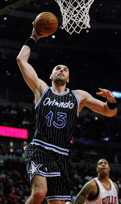 CHICAGO - FEBRUARY 10: Marcin Gortat #13 of the Orlando Magic goes up for a dunk against the Chicago Bulls at the United Center on February 10, 2010 in Chicago, Illinois. The Magic defeated the Bulls 107-87. NOTE TO USER: User expressly acknowledges and a