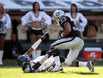 Tyvon Branch gets a halloween bounce as he catches an INT out of the receiver's hand.