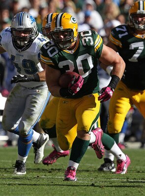 GREEN BAY, WI - OCTOBER 03: John Kuhn #30 of the Green Bay Packers runs against the Detroit Lions at Lambeau Field on October 3, 2010 in Green Bay, Wisconsin. The Packers defeated the Lions 28-26.  (Photo by Jonathan Daniel/Getty Images)