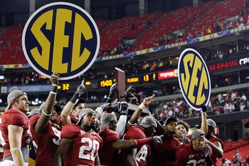 ATLANTA - DECEMBER 05:  Members of the Alabama Crimson Tide celebrate after defeating the Florida Gators 31-13 during the SEC Championship at the Georgia Dome on December 5, 2009 in Atlanta, Georgia.  (Photo by Chris Graythen/Getty Images)