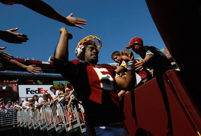 LANDOVER, MD - OCTOBER 10:  Quarterback Donovan McNabb #5 of the Washington Redskins greets fans before playing against the Green Bay Packers at FedExField on October 10, 2010 in Landover, Maryland.  (Photo by Win McNamee/Getty Images)