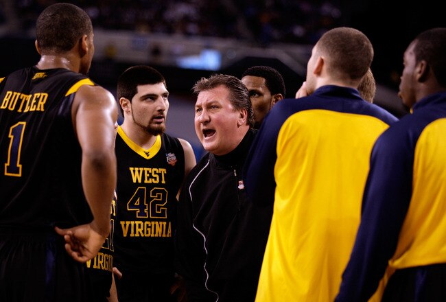 INDIANAPOLIS - APRIL 03:  Head coach Bob Huggins of the West Virginia Mountaineers yells at his players during a timeout in the first half against the Duke Blue Devils during the National Semifinal game of the 2010 NCAA Division I Men's Basketball Champio