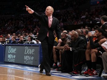 NEW YORK - MARCH 10:  Head coach Mick Cronin of the Cincinnati Bearcats gestures from the bench against the Louisville Cardinals during the second round of 2010 NCAA Big East Tournament at Madison Square Garden on March 10, 2010 in New York City.  (Photo