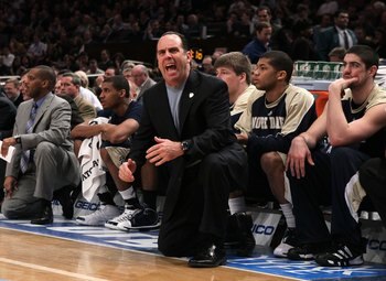 NEW YORK - MARCH 11:  Head coach Mike Brey of the Notre Dame Fighting Irish looks on from the bench against the Seton Hall Pirates during the second round of 2010 NCAA Big East Tournament at Madison Square Garden on March 10, 2010 in New York City.  (Phot