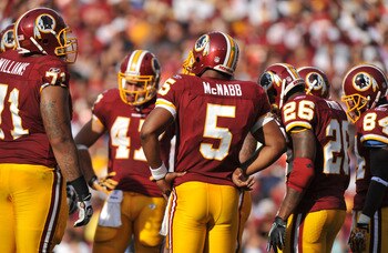 LANDOVER - SEPTEMBER 19:  Donovan McNabb #5 of the Washington Redskins leads the huddle during the game against the Houston Texans at FedExField on September 19, 2010 in Landover, Maryland. The Texans defeated the Redskins in overtime 30-27. (Photo by Lar