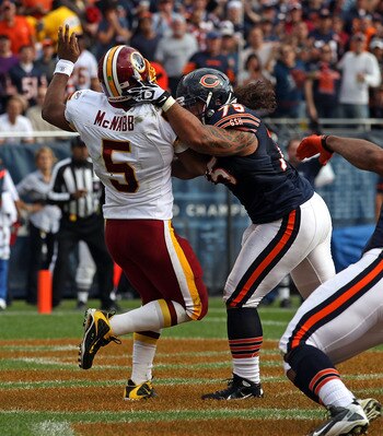 CHICAGO - OCTOBER 24: Matt Toeaina #75 of the Chicago Bears hits Donovan McNabb #5 of the Washington Redskins after a pass at Soldier Field on October 24, 2010 in Chicago, Illinois. The Redskins defeated the Bears 17-14. (Photo by Jonathan Daniel/Getty Im