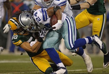 GREEN BAY, WI - NOVEMBER 07: Frank Zombo #58 of the Green Bay Packers tackles Marion Barber #24 of the Dallas Cowboys at Lambeau Field on November 7, 2010 in Green Bay, Wisconsin. (Photo by Jonathan Daniel/Getty Images)