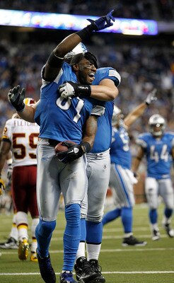DETROIT - OCTOBER 31: Calvin Johnson #81 of the Detroit Lions celebrates with teammate Jeff Backus #76 after scoring a touchdown during the fourth quarter of the game against the Washington Redskins at Ford Field on October 31, 2010 in Detroit, Michigan.