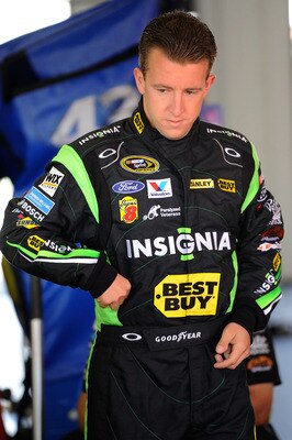 LONG POND, PA - JULY 31:  AJ Allmendinger, driver of the #43 Insignia HDTV Ford, waits in the garage during practice for the NASCAR Sprint Cup Series Sunoco Red Cross Pennsylvania 500 at Pocono Raceway on July 31, 2010 in Long Pond, Pennsylvania.  (Photo