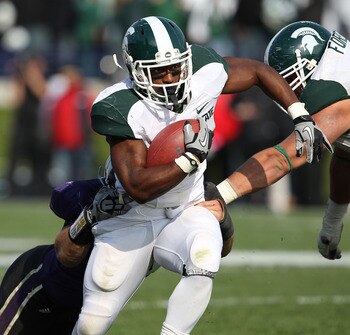 EVANSTON, IL - OCTOBER 23: Edwin Baker #4 of the Michigan State Spartans breaks away from Brian Peters #10 of the Northwestern Wildcats at Ryan Field on October 23, 2010 in Evanston, Illinois. Michigan State defeated Northwestern 35-27.  (Photo by Jonatha
