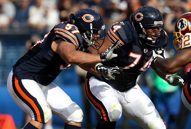 CHICAGO - OCTOBER 24: Olin Kreutz #57 and Chris Williams #74 of the Chicago Bears move to block against the Washington Redskins at Soldier Field on October 24, 2010 in Chicago, Illinois. The Redskins defeated the Bears 17-14. (Photo by Jonathan Daniel/Get