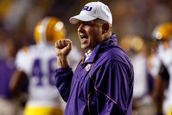 BATON ROUGE, LA - SEPTEMBER 25:  Head coach Les Miles of the Louisiana State University Tigers cheers during pregame before playing the West Virginia Mountaineers at Tiger Stadium on September 25, 2010 in Baton Rouge, Louisiana.  The Tigers defeated the M