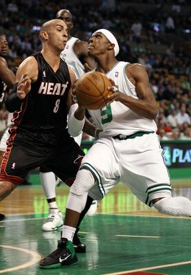 BOSTON - APRIL 27:  Rajon Rondo #9 of the Boston Celtics heads for the net as Carlos Arroyo #8 of the Miami Heat defends during Game Five of the Eastern Conference Quarterfinals of the 2010 NBA playoffs at the TD Garden on April 27, 2010 in Boston, Massac