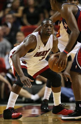 MIAMI - MAY 01:  Dwyane Wade #3 of the Miami Heat plays tight defense on Joe Johnson #2 of the Atlanta Hawks during Game Six of the Eastern Conference Quarterfinals at American Airlines Arena on May 1, 2009 in Miami, Florida. NOTE TO USER: User expressly