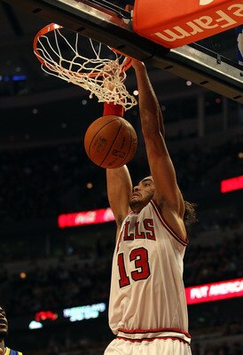 CHICAGO - NOVEMBER 11: Joakim Noah #13 of the Chicago Bulls dunks the ball against the Golden State Warriors at the United Center on November 11, 2010 in Chicago, Illinois. The Bulls defeated the Warriors 120-90. NOTE TO USER: User expressly acknowledges