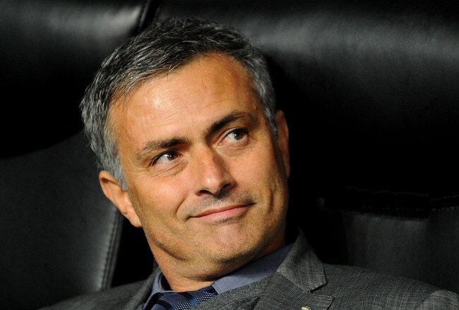 MILAN, ITALY - NOVEMBER 03: Head coach Jose Mourinho of Real Madrid smiles during the Uefa Champions League group G match between AC Milan and Real Madrid at Stadio Giuseppe Meazza on November 3, 2010 in Milan, Italy.  (Photo by Massimo Cebrelli/Getty Ima
