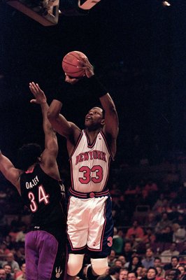 23 Apr 2000: Patrick Ewing #33 of the New York Knicks leaps for the basket as he is guarded by Charles Oakley #34 of the Toronto Raptorsduring the NBA Eastern Conference Round One Game at Madison Square Garden in New York New York. The Knicks defeated the