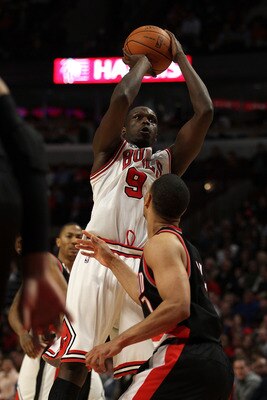 CHICAGO - NOVEMBER 01: Loul Deng #9 of the Chicago Bulls puts up a shot over Brandon Roy #7 of the Portland Trail Blazers on his way to a game-high 40 points at the United Center on November 1, 2010 in Chicago, Illinois. The Bulls defeated the Trail Blaze