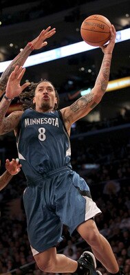 LOS ANGELES - NOVEMBER 9: Michael Beasley #8 of the Minnesota Timberwolves goes up for a shot against Matt Barnes #9 of the Los Angeles Lakers at Staples Center on November 9, 2010 in Los Angeles, California. The Lakers won 99-94.   NOTE TO USER: User exp