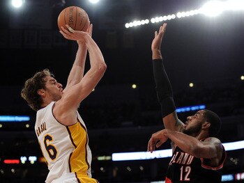 LOS ANGELES, CA - NOVEMBER 07:  Pau Gasol #16 of the Los Angeles Lakers shoots a jumper over LaMarcus Aldridge #12 of the Portland Trail Blazers at the Staples Center on November 7, 2010 in Los Angeles, California.  NOTE TO USER: User expressly acknowledg