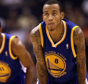 PHOENIX - OCTOBER 19:  Monta Ellis #8 (R) and Aaron Miles #11 of the Golden State Warriors await a free throw shot against the Phoenix Suns during the preseason NBA game at US Airways Center on October 19, 2010 in Phoenix, Arizona. NOTE TO USER: User expr