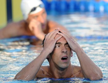 IRVINE, CA - AUGUST 07:  Michael Phelps reacts after his swim in the 200 LC Meter Backstroke Final during the 2010 ConocoPhillips National Championships at the William Woollett Jr. Aquatics Complex on August 7, 2010 in Irvine, California. Phelps finished