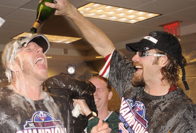 WASHINGTON - SEPTEMBER 27:  Roy Halliday and Jayson Werth of the Philadelphia Phillies celebrate clinching the National League east title after a baseball game against the Washington Nationals on September 27, 2010 at Nationals Park in Washington, D.C.  T