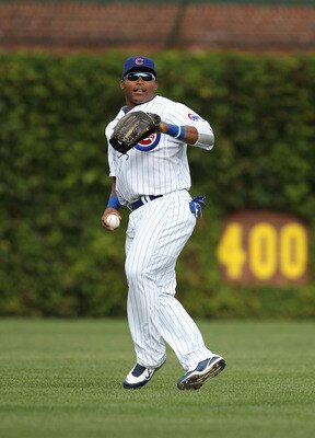CHICAGO - SEPTEMBER 05: Marlon Byrd #24 of the Chicago Cubs prepares to throw the ball to the infield against the New York Mets at Wrigley Field on September 5, 2010 in Chicago, Illinois. The Mets defeated the Cubs 18-5. (Photo by Jonathan Daniel/Getty Im