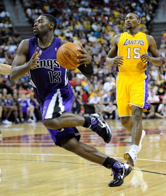LAS VEGAS - OCTOBER 13:  Tyreke Evans #13 of the Sacramento Kings drives ahead of Ron Artest #15 of the Los Angeles Lakers during their preseason game at the Thomas & Mack Center October 13, 2010 in Las Vegas, Nevada. The Lakers won 98-95. NOTE TO USER: U