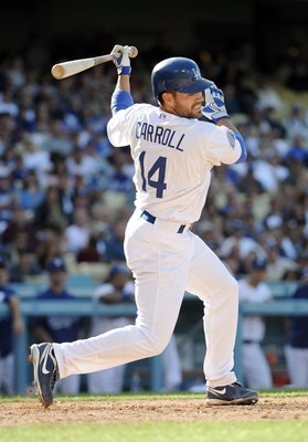 LOS ANGELES, CA - MAY 22:  Jamey Carroll #14 of the Los Angeles Dodgers takes a swing during his at bat against the Detroit Tigers at Dodger Stadium on May 22, 2010 in Los Angeles, California.  (Photo by Harry How/Getty Images)