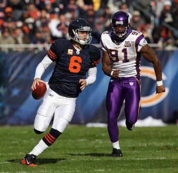 CHICAGO - NOVEMBER 14: Jay Cutler #6 of the Chicago Bears runs for a first down as Ray Edwards #91 of the Minnesota Vikings gives chase at Soldier Field on November 14, 2010 in Chicago, Illinois. The Bears defeated the Vikings 27-13. (Photo by Jonathan Da
