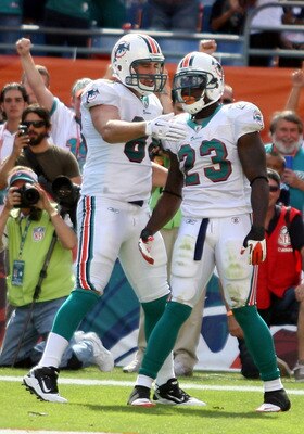 MIAMI - NOVEMBER 14:  Running Back Ronnie Brown #23 of the Miami Dolphins celebrates a touchdown with teammate Anthony Fasano #80 against the Tennessee Titans at Sun Life Stadium on November 14, 2010 in Miami, Florida.  (Photo by Marc Serota/Getty Images)